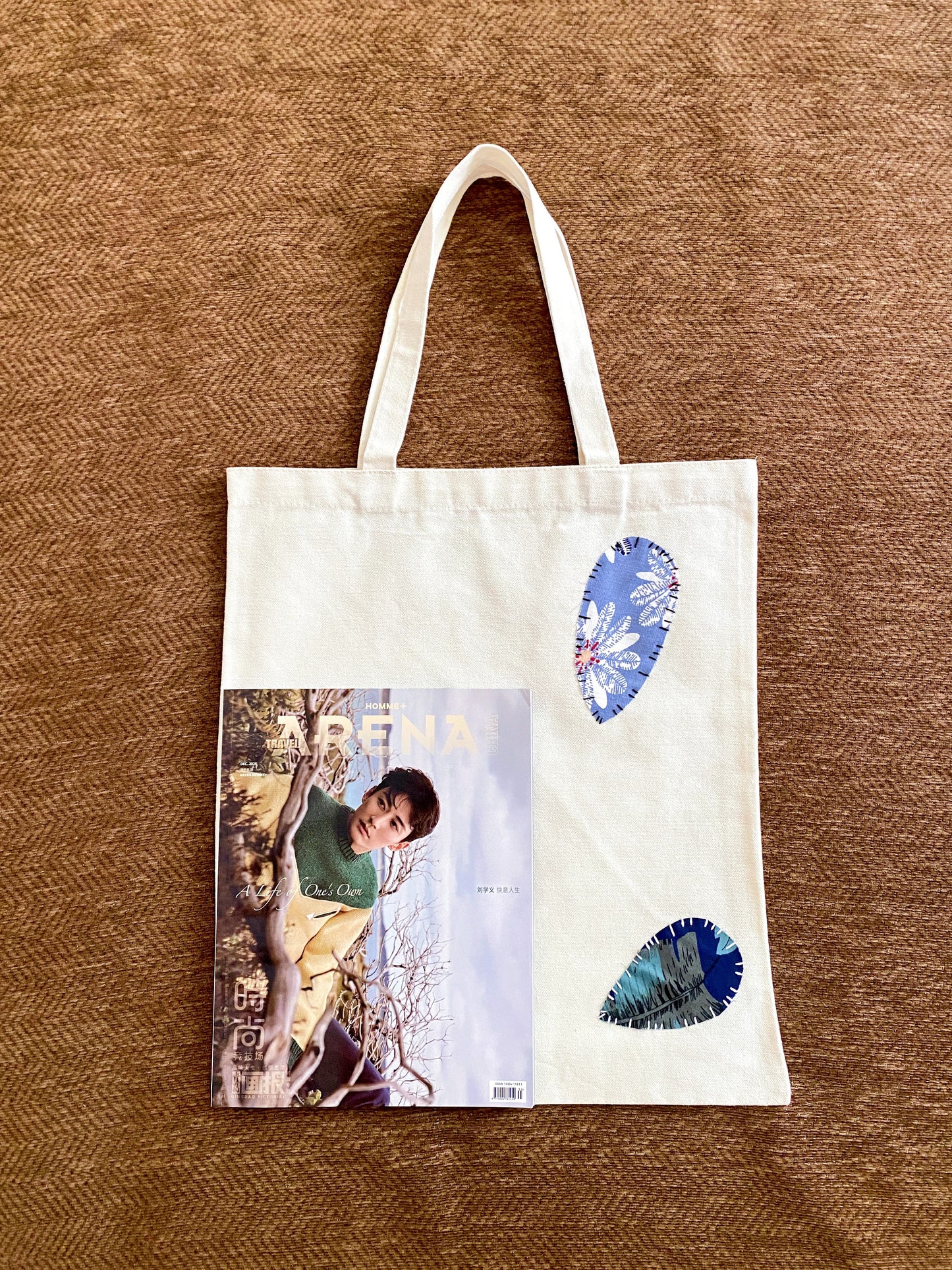 Natural fabric tote bag with handmade patchwork design for thoughtful gifting