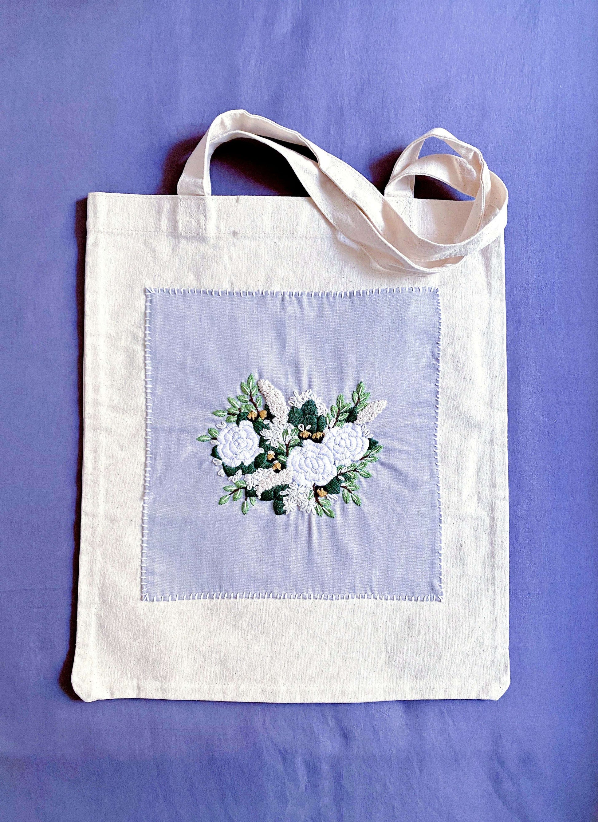 Beyond being a reusable shopping bag, this heavy-duty canvas tote represents a shift toward mindful consumption and supporting traditional needlework.