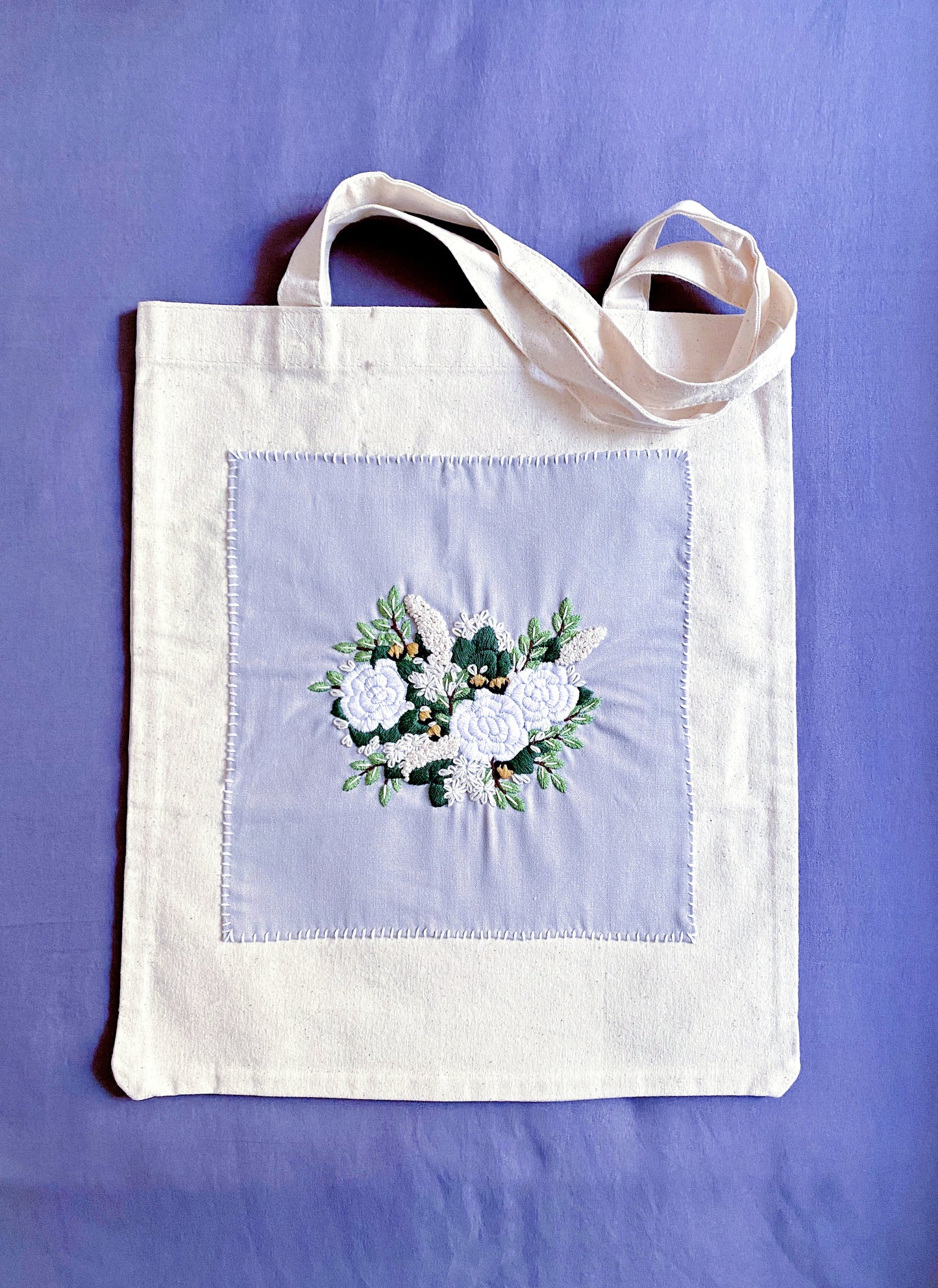 Beyond being a reusable shopping bag, this heavy-duty canvas tote represents a shift toward mindful consumption and supporting traditional needlework.