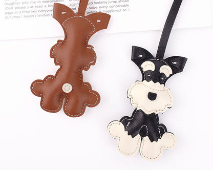 Soft filled puppy figure used as a bag decoration
