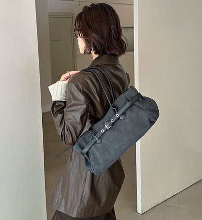 A canvas carryall featuring a clean, contemporary silhouette