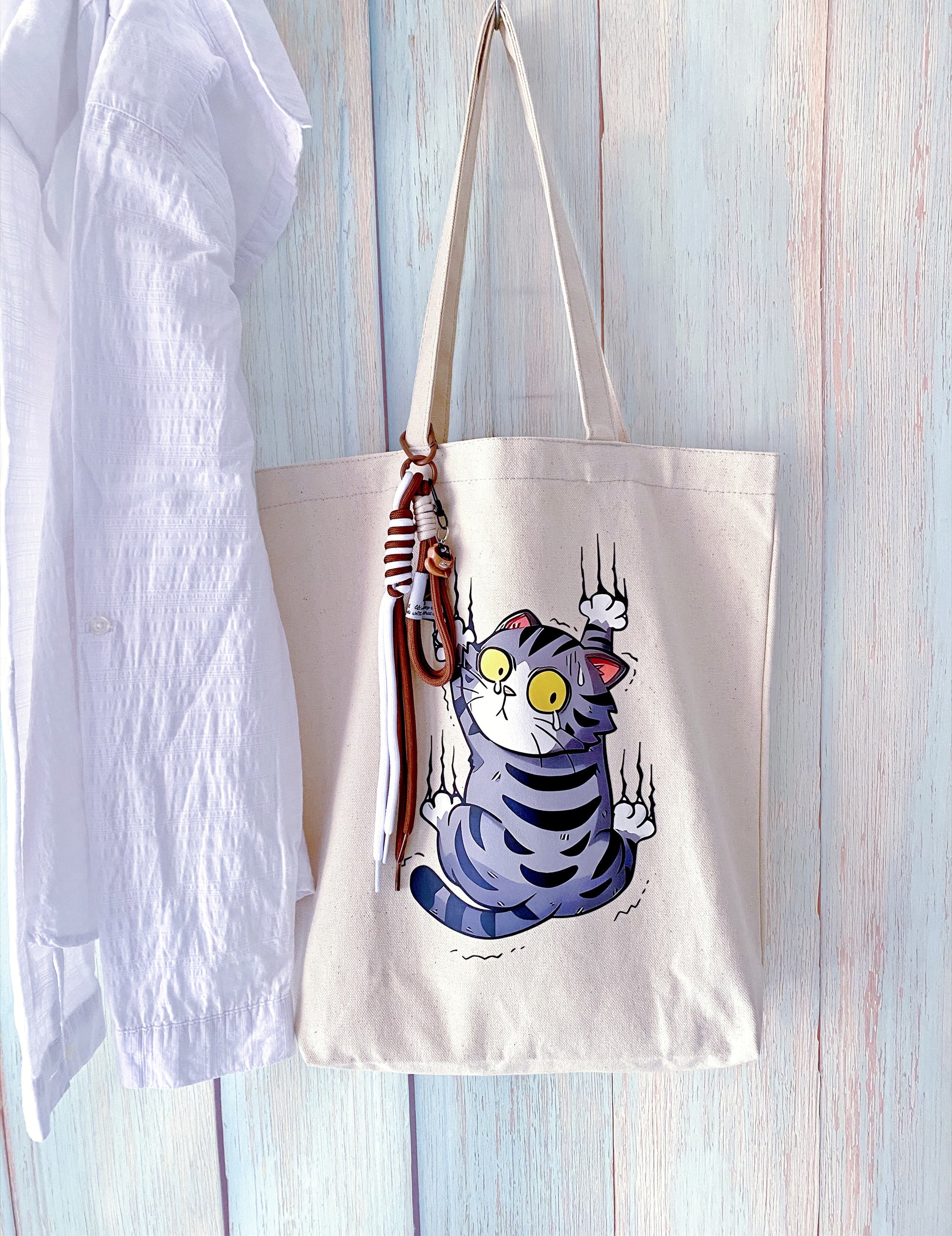 soft foldable tote bag with subtle handmade cat artwork and an easygoing feel
