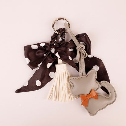 Polka dot scarf bow with handmade charm detail