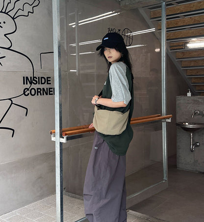 Compact crossbody pouch for daily essentials