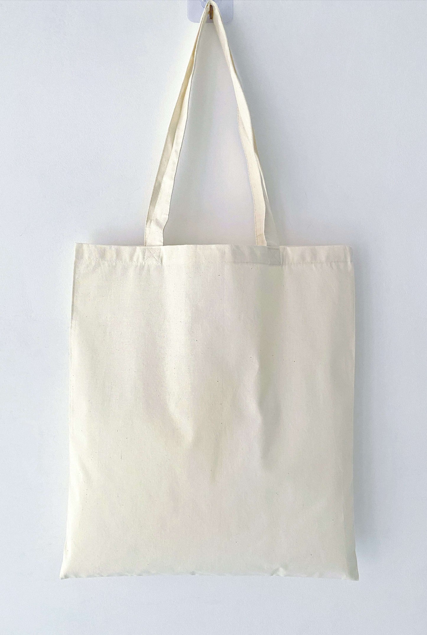 Natural cotton carry bag with minimalist woman illustration