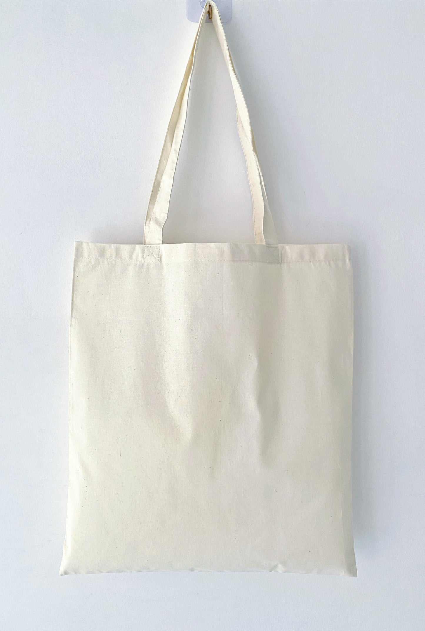 Natural cotton carry bag with minimalist woman illustration