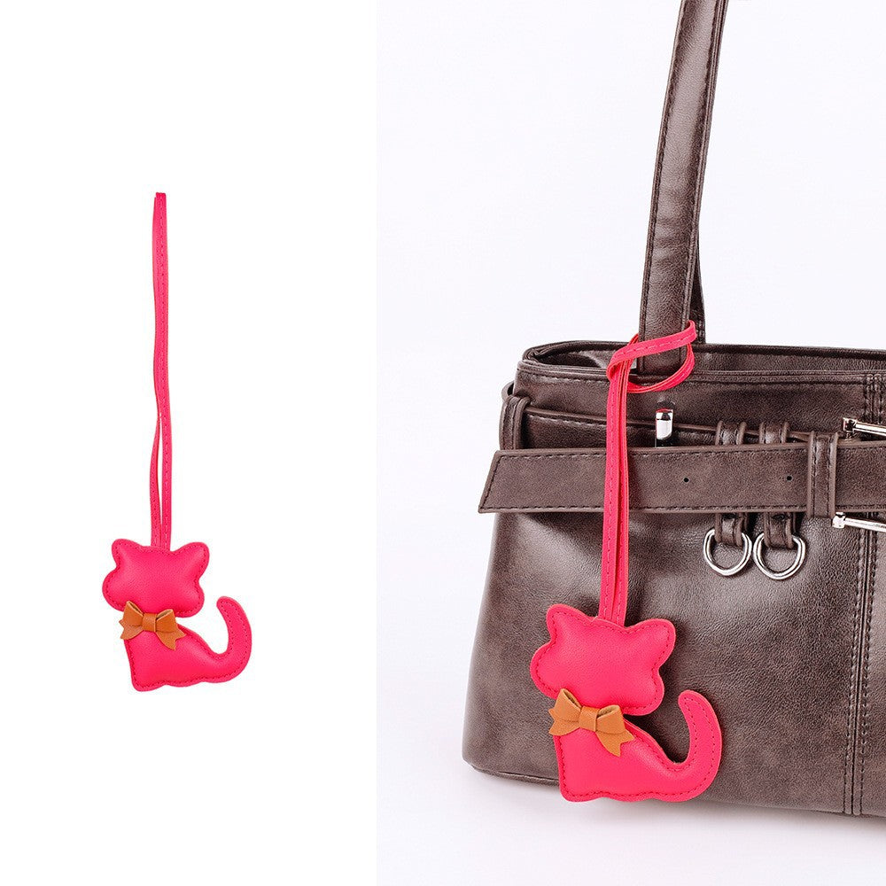 Scarf cat charm clipped onto a canvas tote