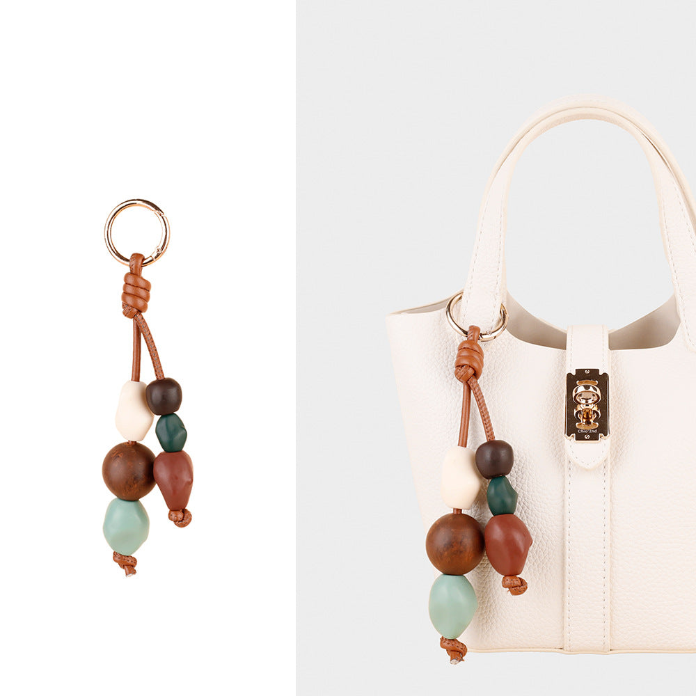 Small artisan bag accessory with individually crafted beads
