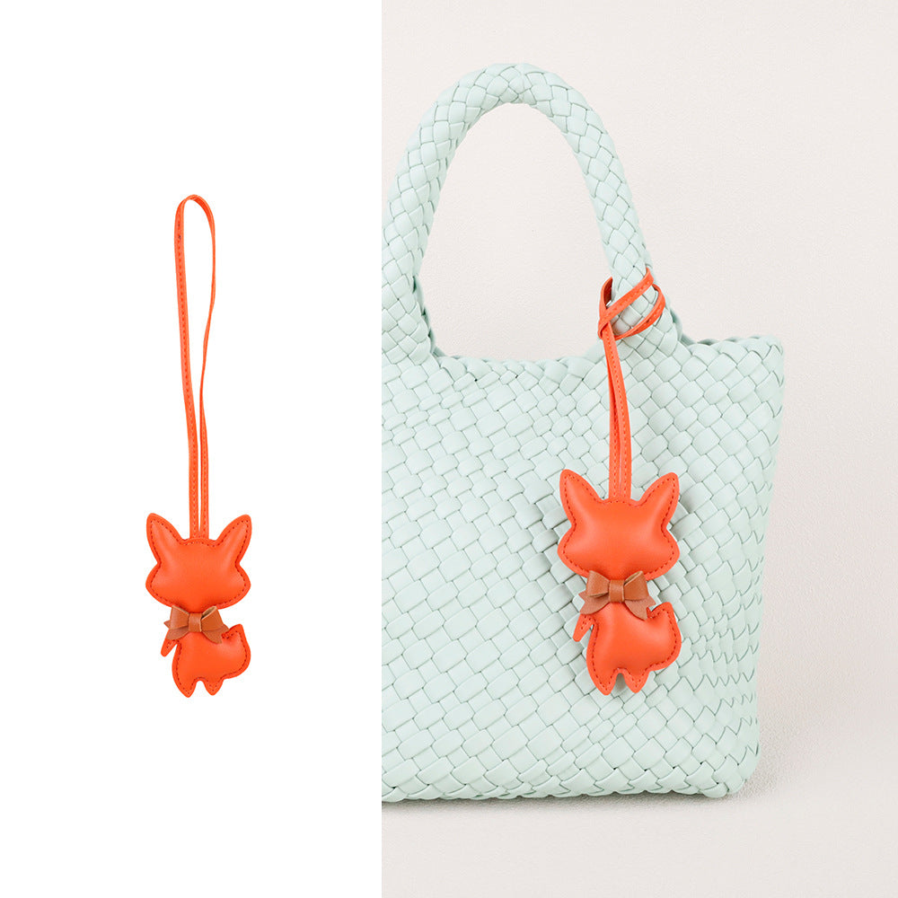 Fox accessory with soft scarf movement and a long tassel