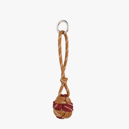 Colorful woven cord bag charm with contrasting round beads
