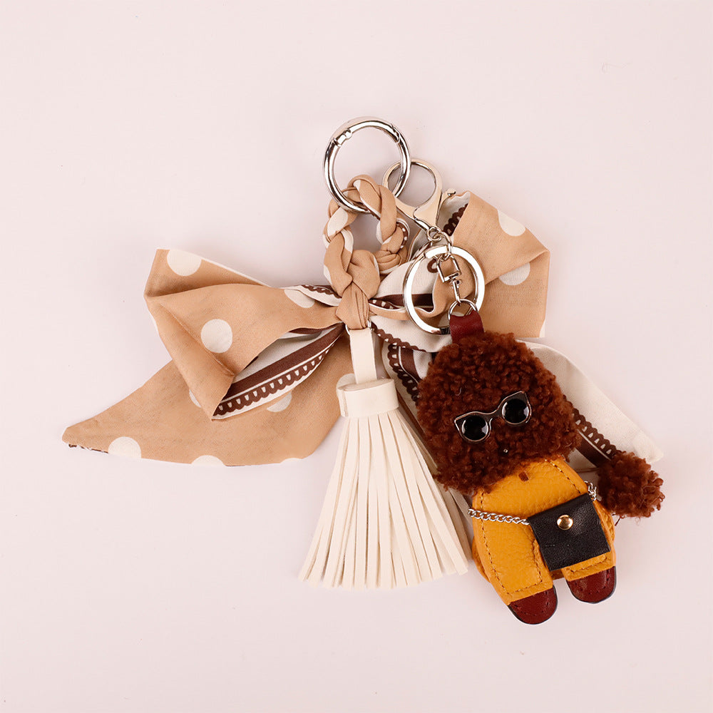 Khaki bow and tassel accessory for a woman's bag