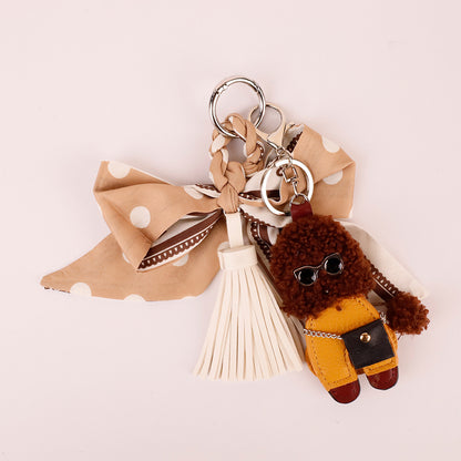 Khaki bow and tassel accessory for a woman's bag