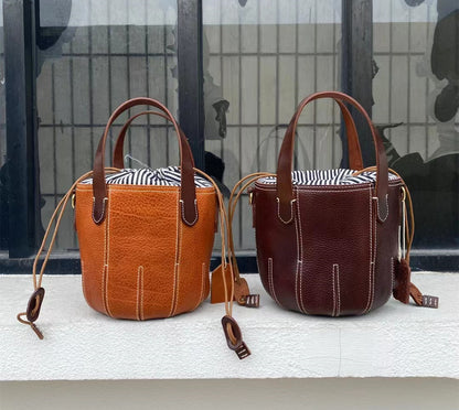 Rustic Leather Bucket Bag with Tassel Detailing