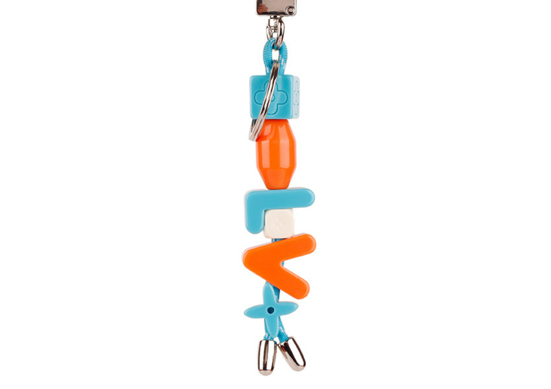 Vibrant alphabet charm paired with minimalist keychain