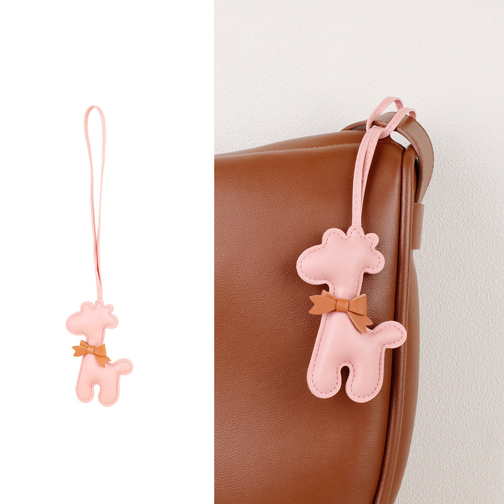 Tassel detail paired with a colorful animal bag charm