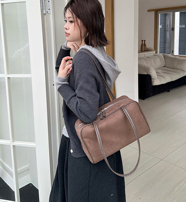 Everyday handbag shown with versatile carrying options