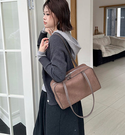 Everyday handbag shown with versatile carrying options