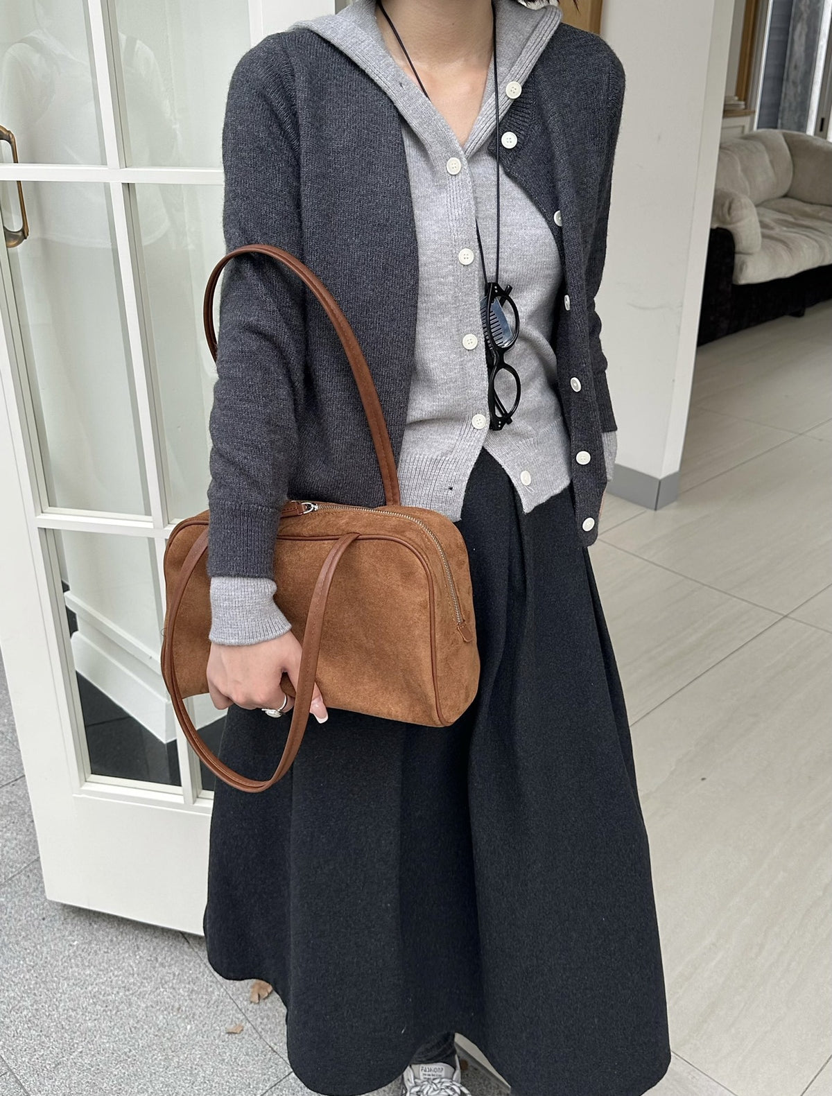 Shoulder bag carried during relaxed daily activities