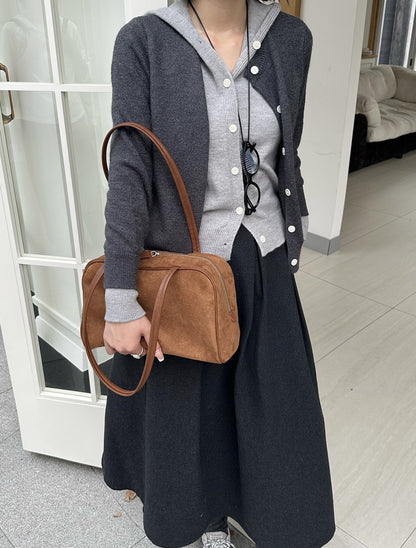 Shoulder bag carried during relaxed daily activities