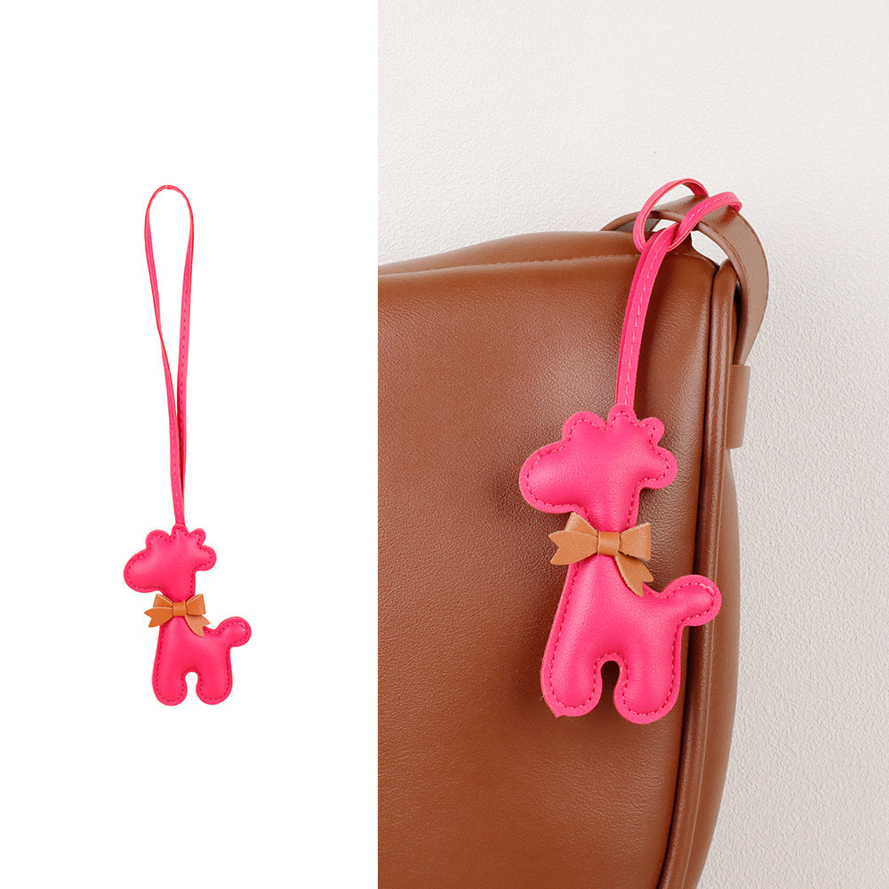 Giraffe accessory adding personality to a simple handbag