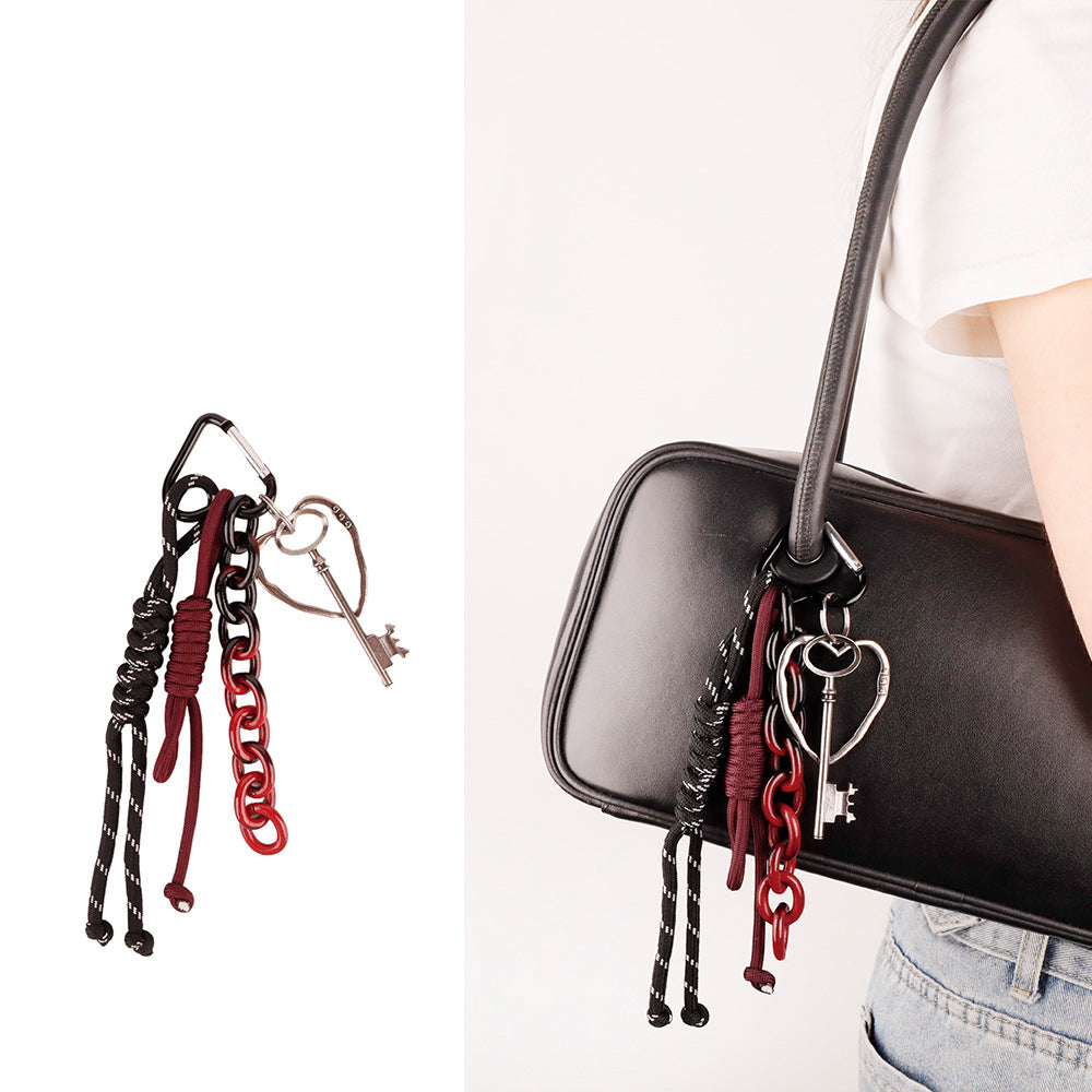Trendy purse accent featuring hand tied knotting and metallic carabiner