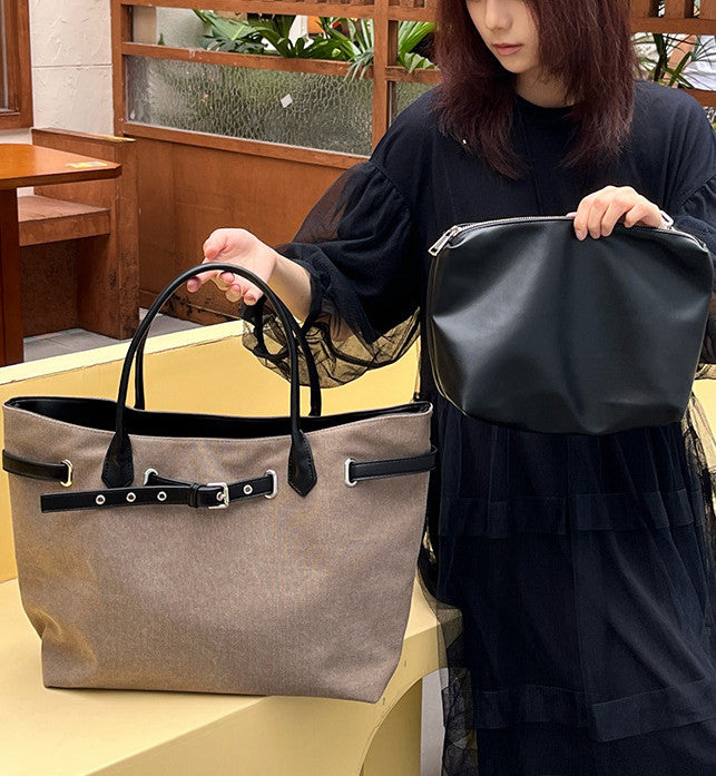 Minimal canvas tote bag carried for casual daily outings