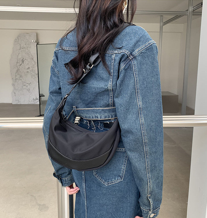 crescent shoulder bag with zipper closure for secure everyday storage
