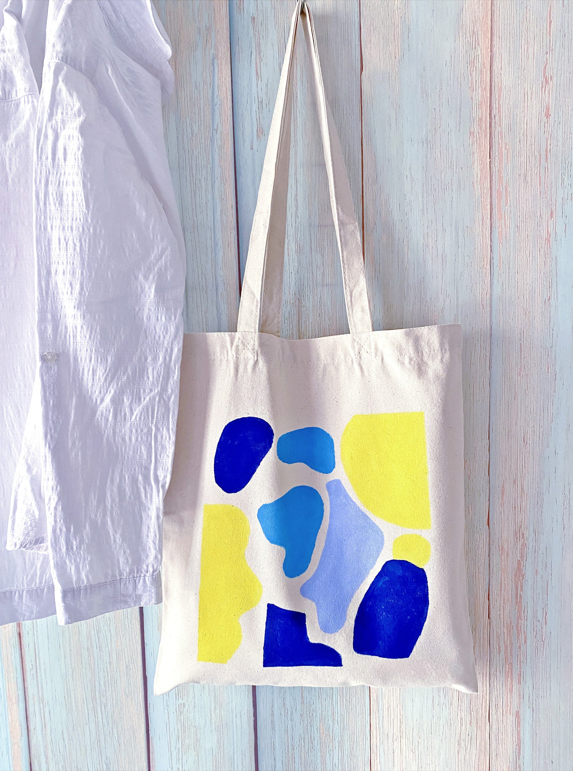 oversized cotton canvas tote carrying a simple hand-sketched graphic