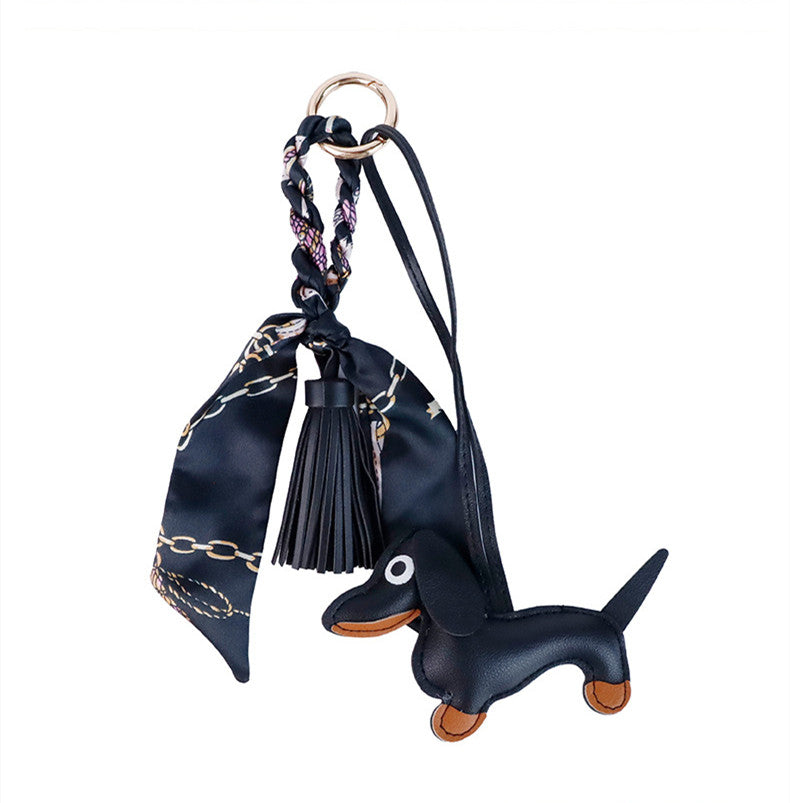 Stylish leather dachshund keychain decorating a structured tote