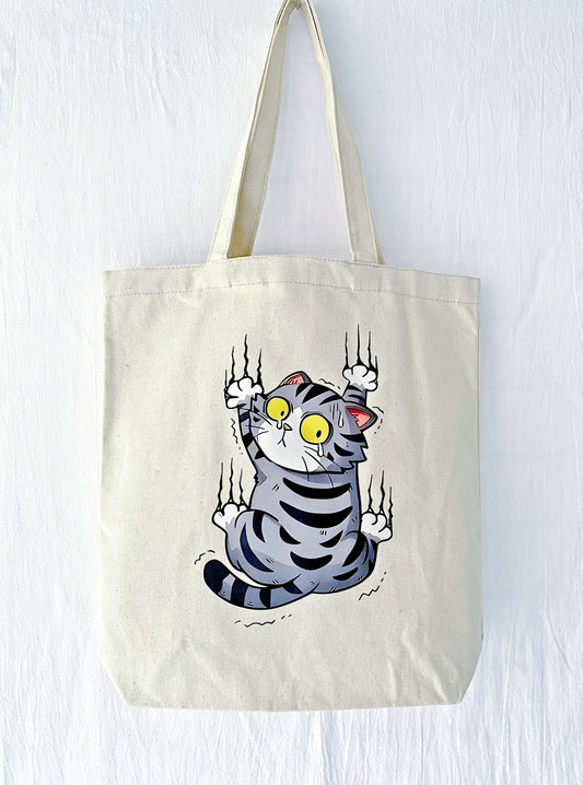 canvas tote bag with hand-printed scared cat illustration