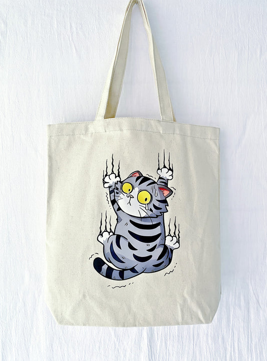 canvas tote bag with hand-printed scared cat illustration