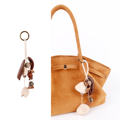 Fruit shell pendant for a natural style bag accent