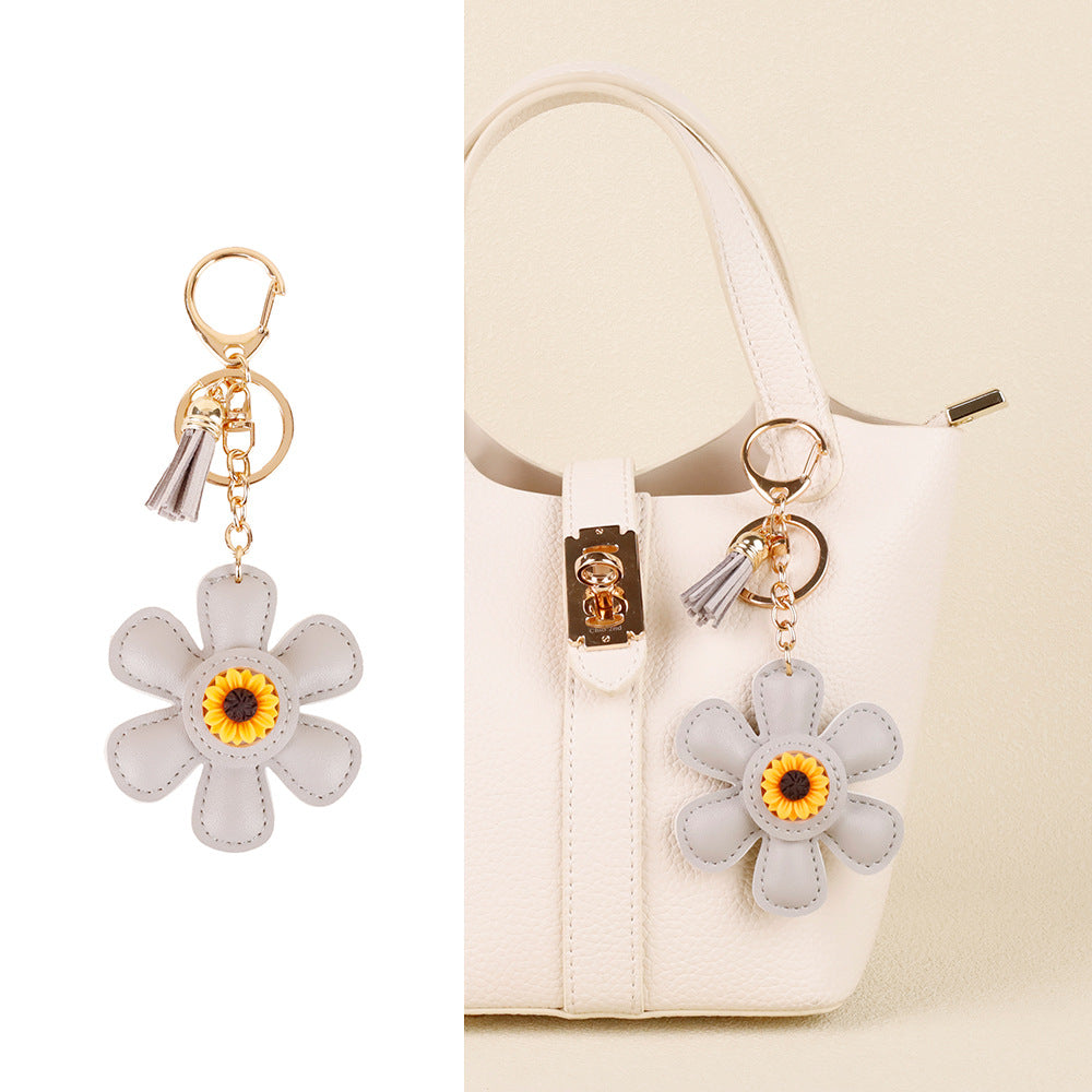 Handmade flower accessory with a long tassel accent