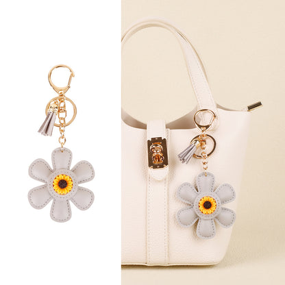 Handmade flower accessory with a long tassel accent