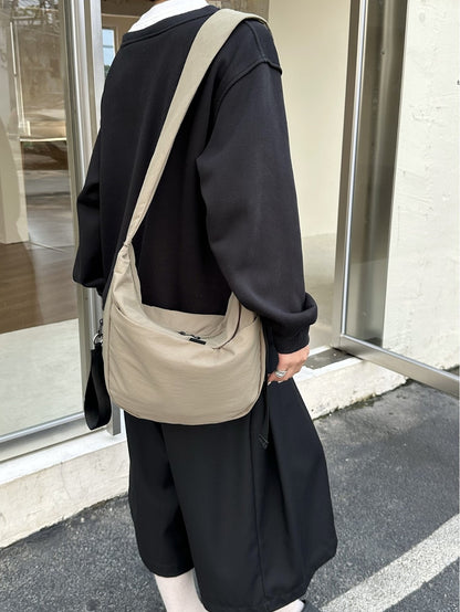 Women's shoulder bag with a broad strap for casual outings