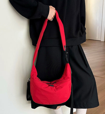 Minimalist shoulder bag with a comfortable wide strap