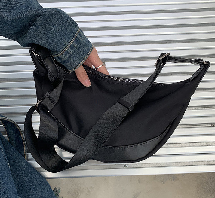 crescent crossbody bag with interior slip pockets for staying organized