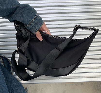 crescent crossbody bag with interior slip pockets for staying organized