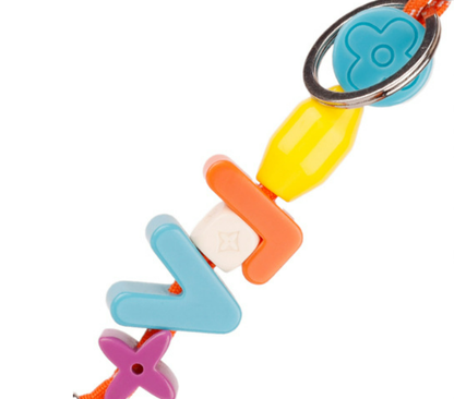 Trendy resin letter accessory on designer backpack