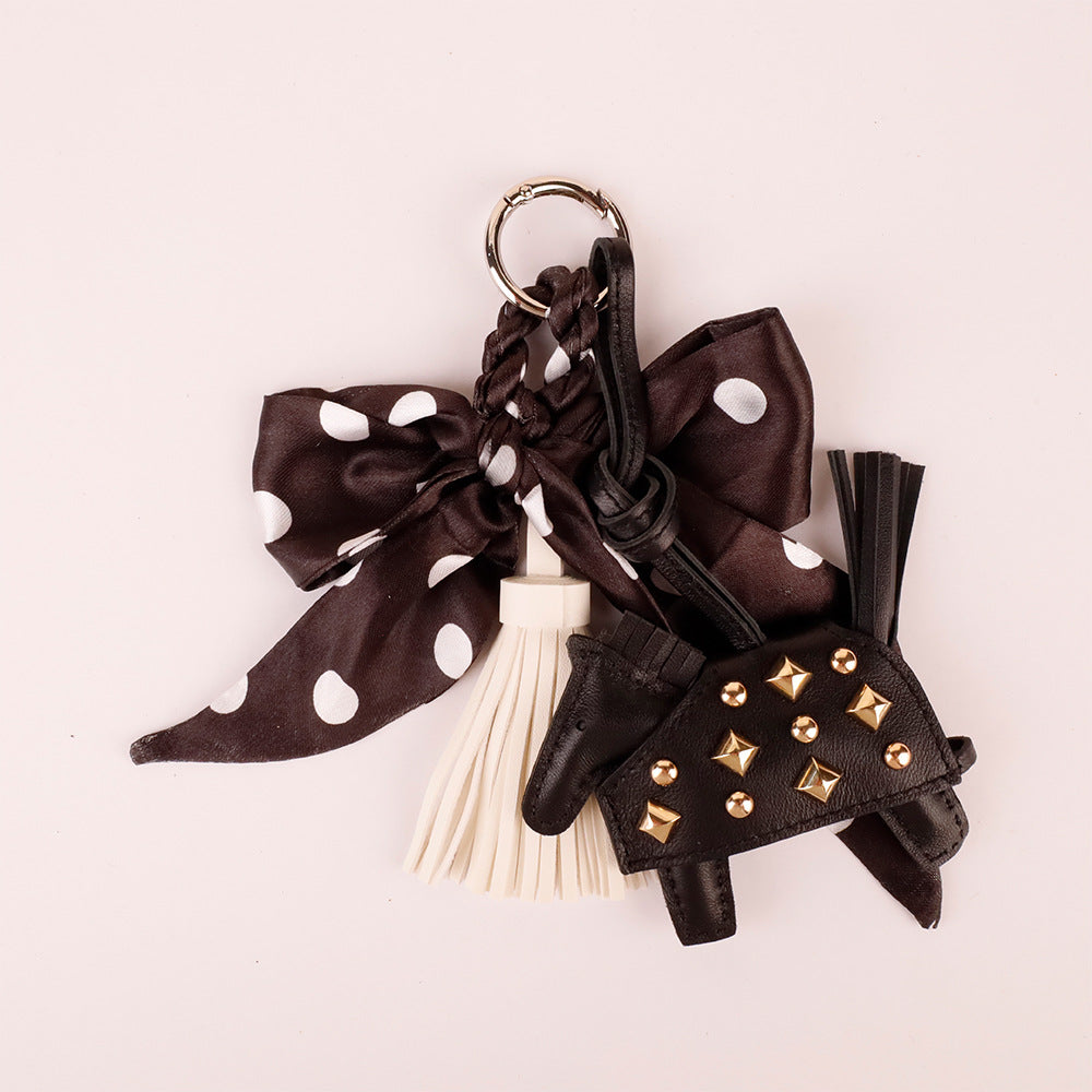 Retro animal charm with a soft fabric bow