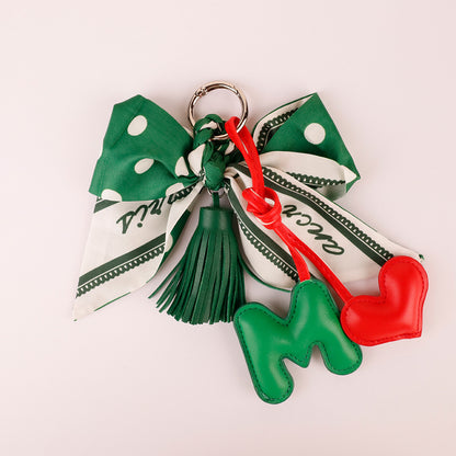 Handcrafted forest green fringe charm with adorable animal figure