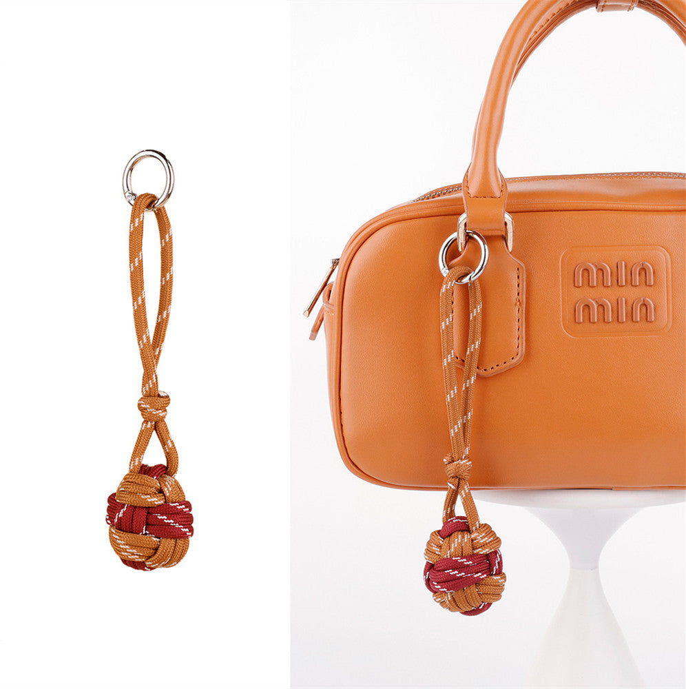 Woven cord phone charm with a handmade look