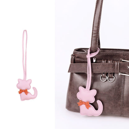 Playful handbag charm with cat and scarf design