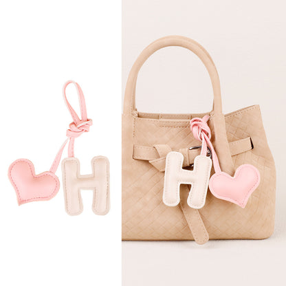 Little alphabet charm adding detail to a bag