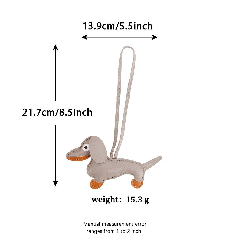 Custom leather dachshund charm enhancing a minimalist handbag setup