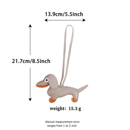 Custom leather dachshund charm enhancing a minimalist handbag setup