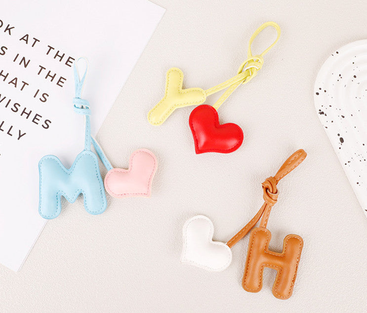 Playful alphabet heart accessory for a handbag