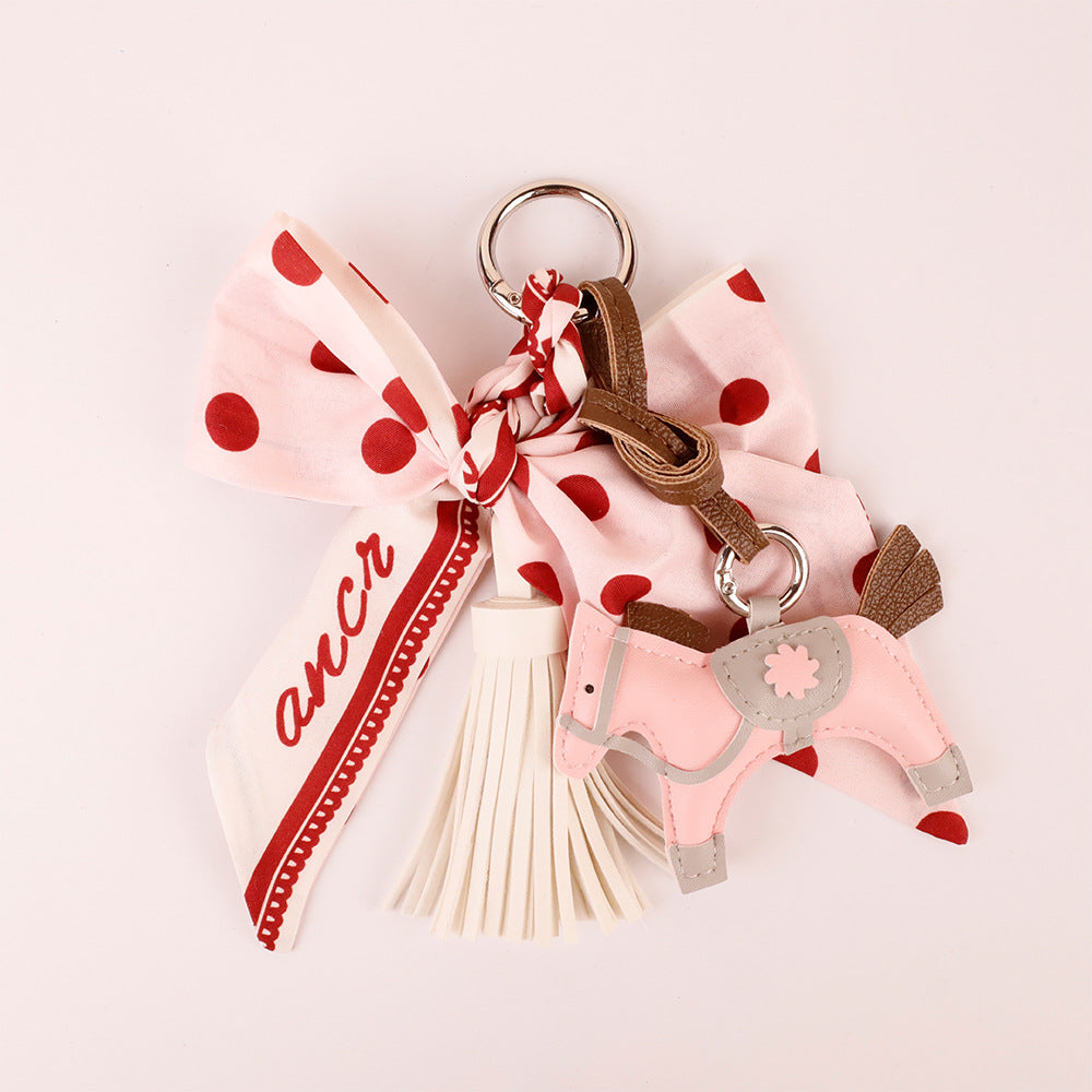 Pink bow bag charm with fabric scarf accents