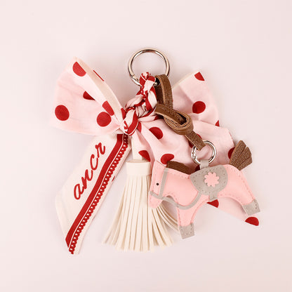 Pink bow bag charm with fabric scarf accents