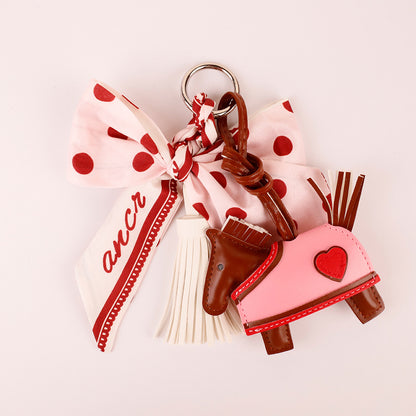 Handmade pink keychain with decorative tassels